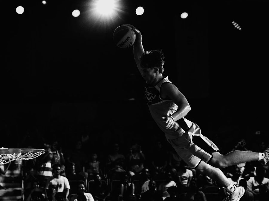 Basketball player flying in for a dunk