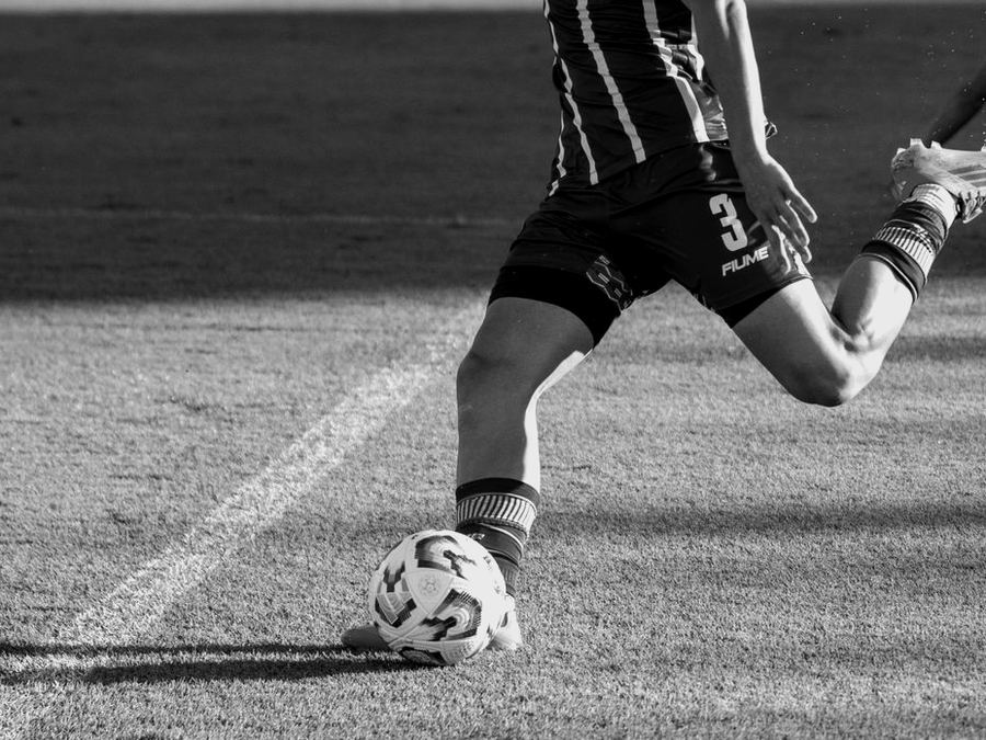 Footballer striking the ball