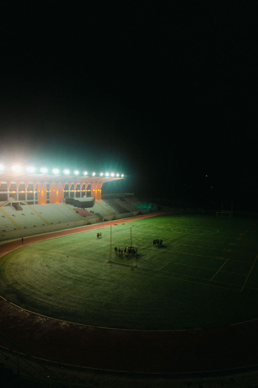Stadium floodlights at night
